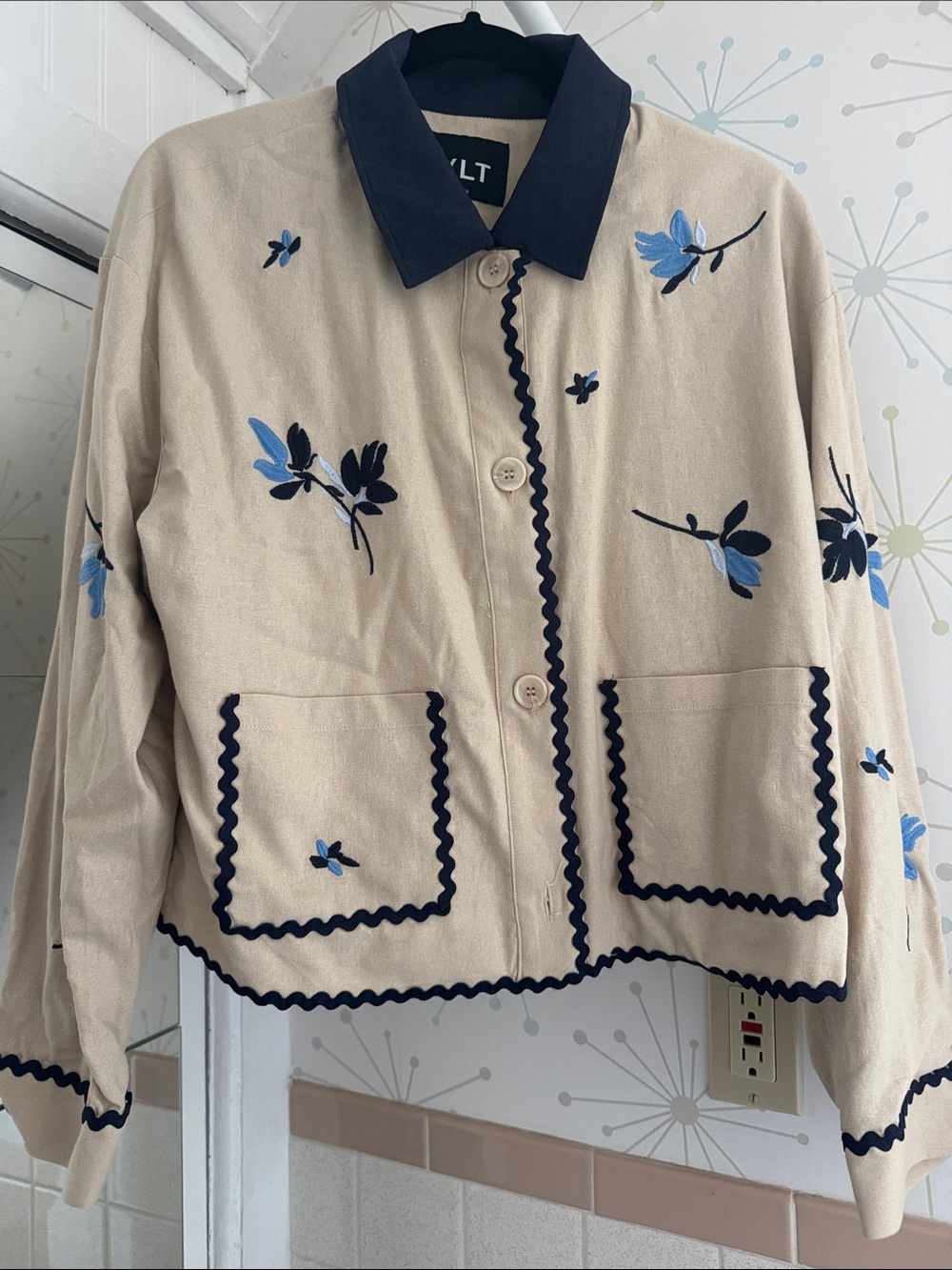 NVLT Beige Jean Jacket with Navy Trim and Blue Floral Embroidery